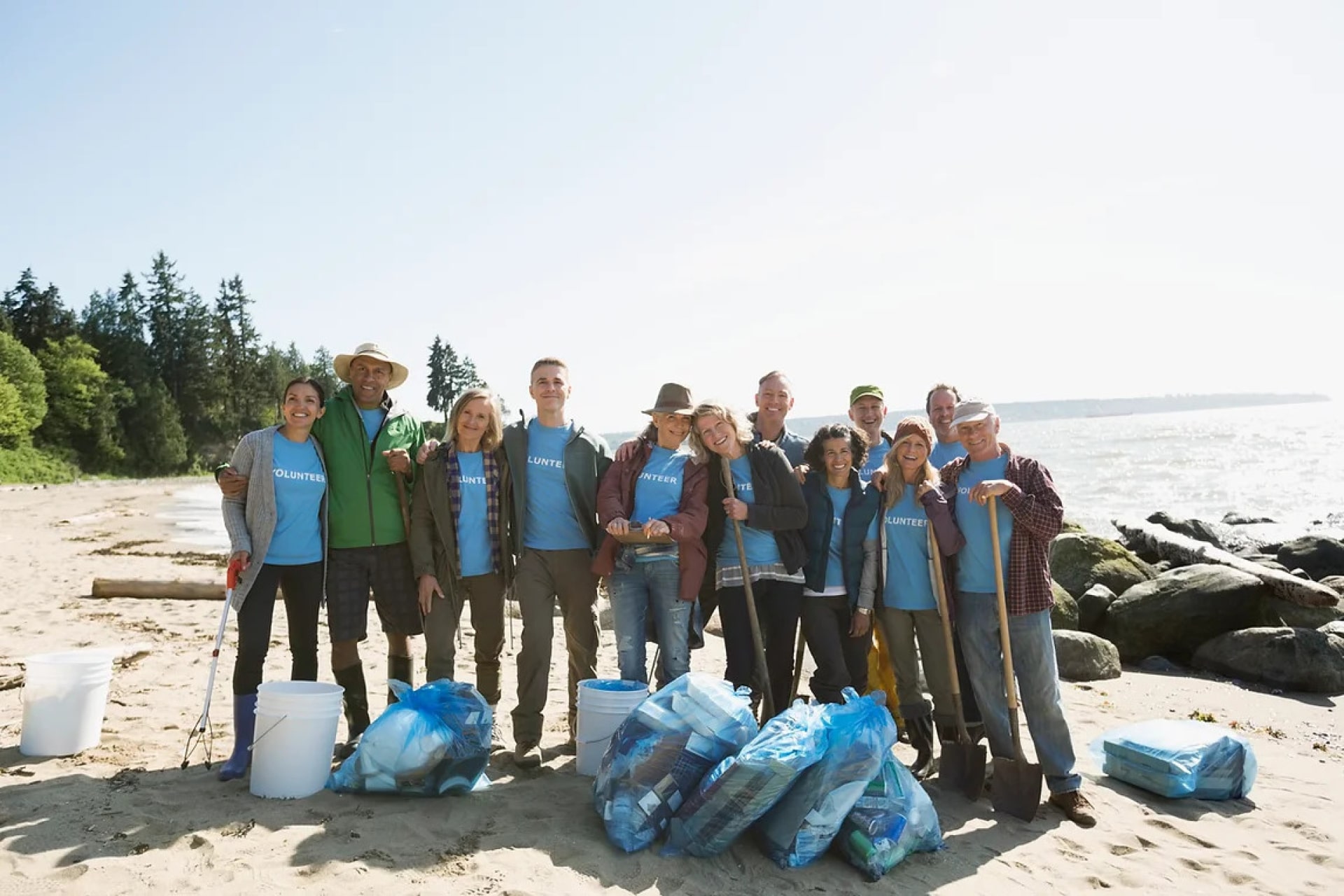 a group of people standing on a beach