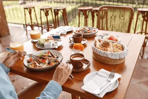 a person eating food at a table