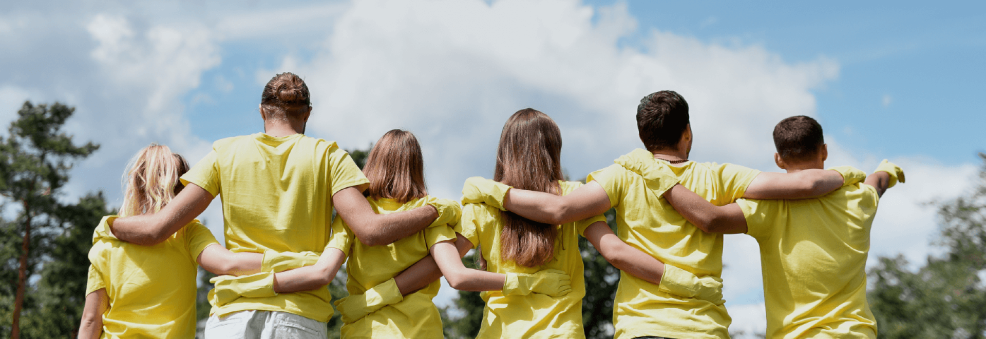 a group of people hugging each other