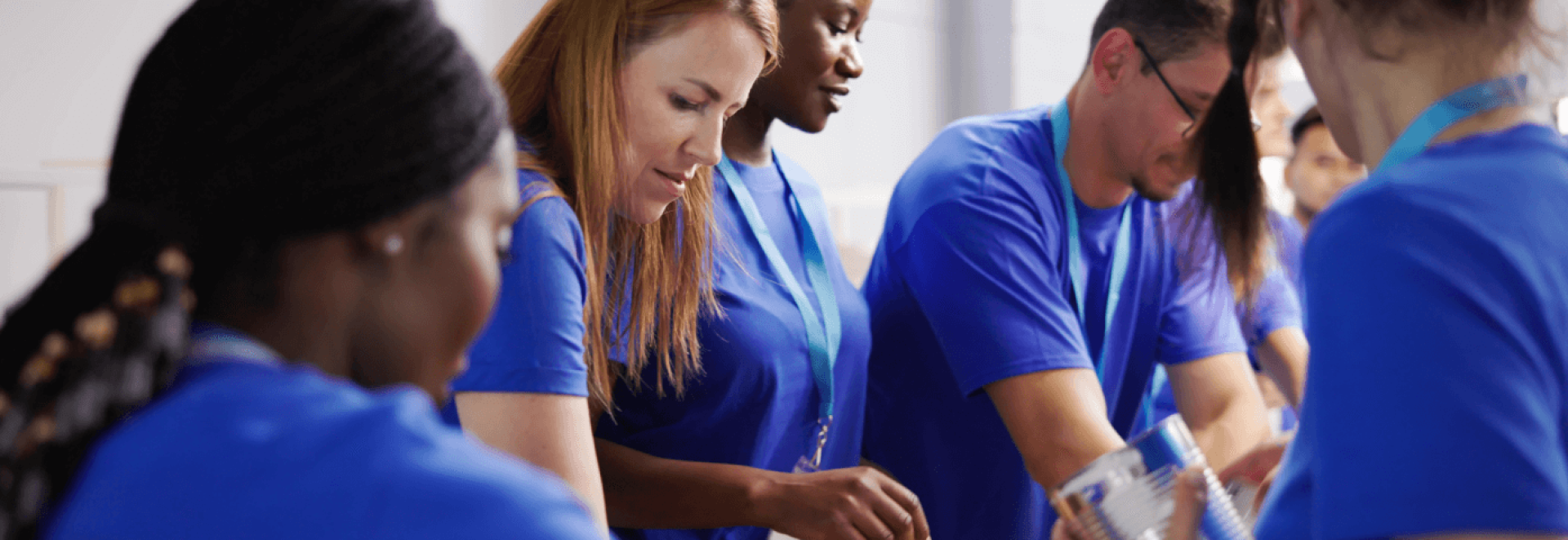 a group of women in blue shirts