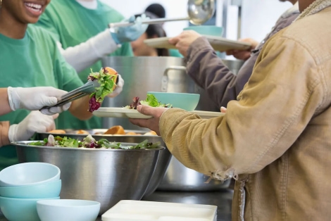 a group of people serving food