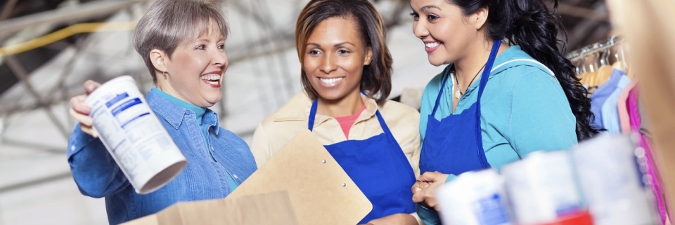 a group of women wearing aprons